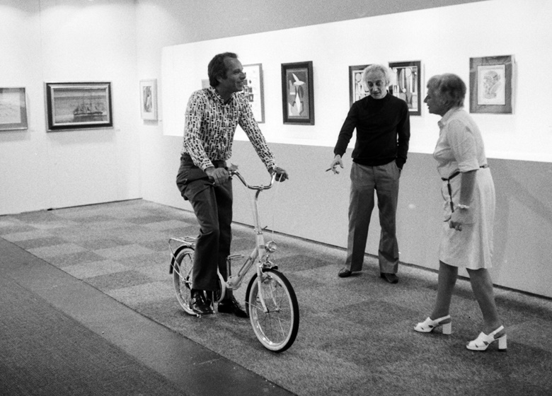 Ernst Beyeler riding through the halls of Art Basel, which he co-founded. Photo Kurt Wyss