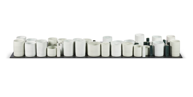 Edmund de Waal (b. 1964), Last Things, 2006. Fifty-nine porcelain vessels, with six celadon glazes and six grey glazes, on a steel plinth. Tallest vessel 7¼ in (19.5 cm) high. Overall 70⅞ in (180 cm) long, including plinth. Sold for £75,600 on 19 October 2022 at Christie’s in London