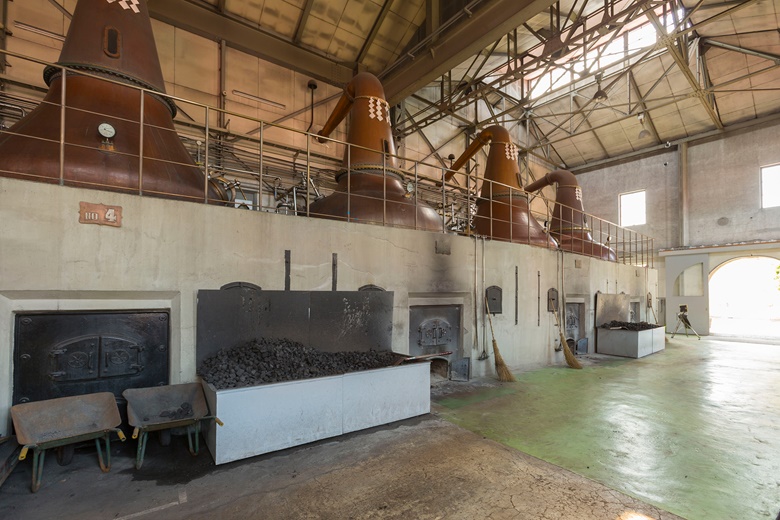 Around the top of the coal-powered stills at Nikka’s Yoichi distillery hang paper streamers — known as shide — used in Shinto ritual blessings. Photo courtesy of Nikka Whisky