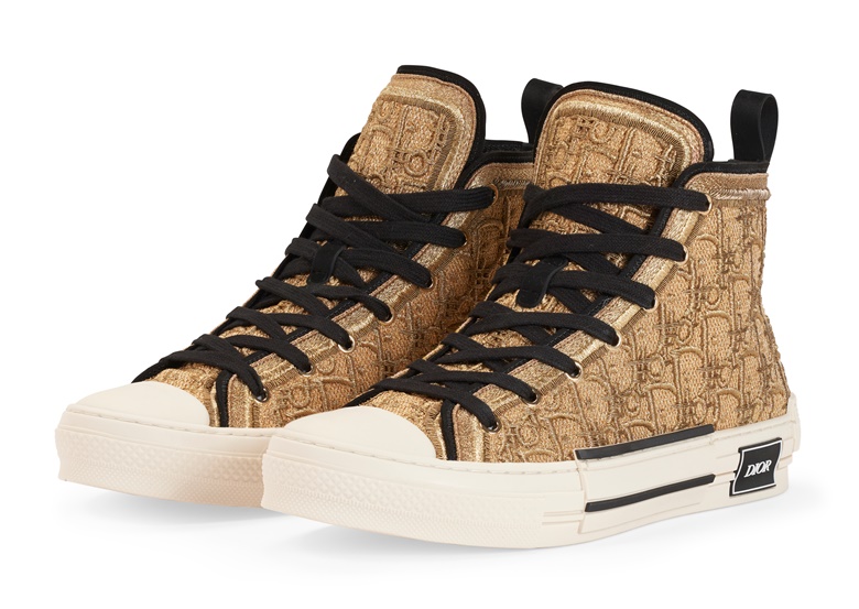 A pair of gold oblique Cannetille B23 high-top sneakers by Peter Doig, Dior, Winter 2021. Size 43 ITEU. Estimate $5,000-7,000. Offered in The Greats from 29 November-8 December at Christies online