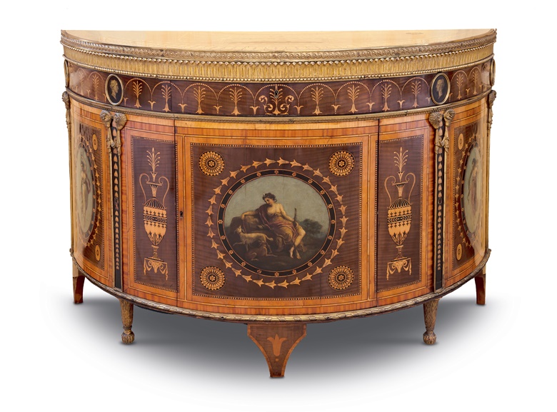 Commode with satinwood, harewood and tulipwood ‘Etruscan’ marquetry, painted decoration and ormolu mounts. By William Ince and John Mayhew, 1775. Made to the designs of Robert Adam for the Earl of Derby. Photo courtesy The Derby Collection