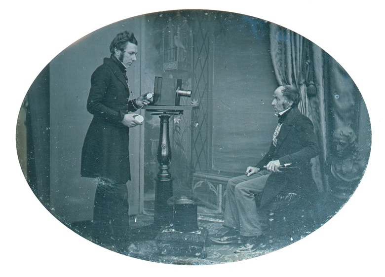 Jabez Hogg and Mr Johnson, 1843. Hogg (1817-1899) is making a daguerreotype of Johnson, timing the exposure with his watch. The daguerreotype was probably taken to illustrate Hogg’s A Practical Manual of Photography. Photo Science & Society Picture Library  Getty Images