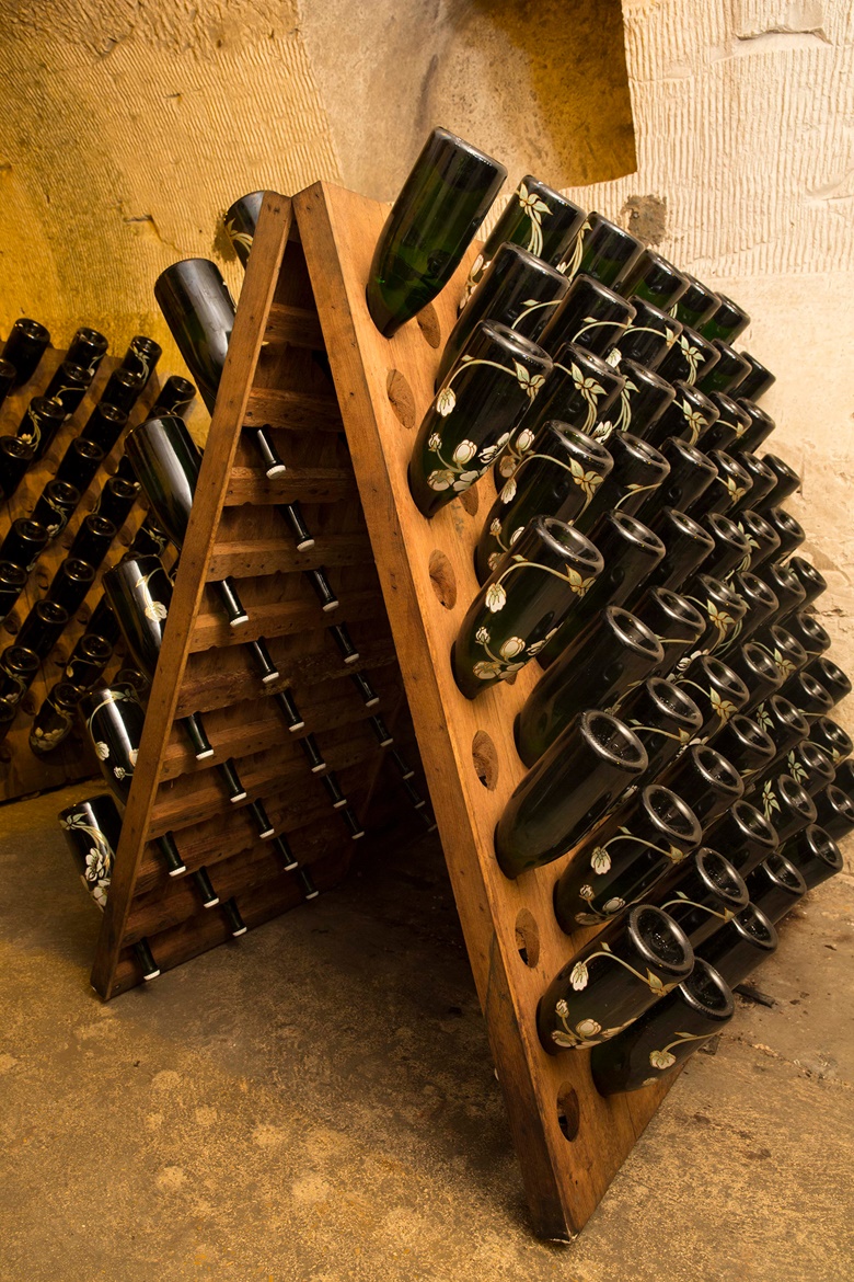 The distinctive bottles of Perrier-Jouët cuvée champagne are decorated with white anemones. Photo courtesy Perrier-Jouët