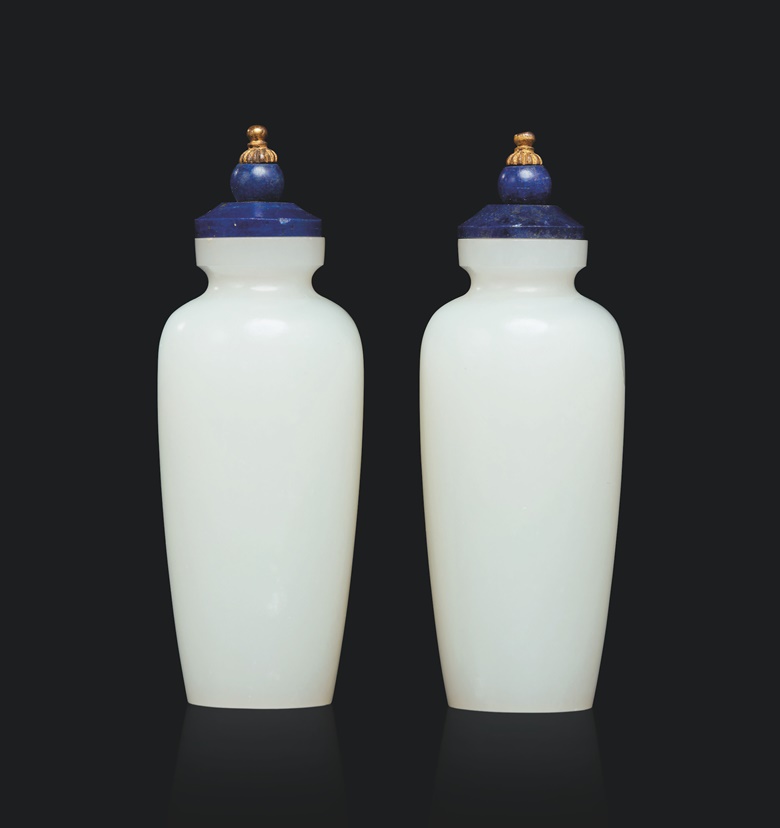 A pair of imperial snuff bottles in white jade with lapis lazuli stoppers, Qing dynasty, Qianlong period (1736-1795). Height 7.6 cm (3 in). Estimate €15,000-25,000. Offered in From Beijing to Versailles, the V.W.S. collection on 13-14 December at Christie’s in Paris