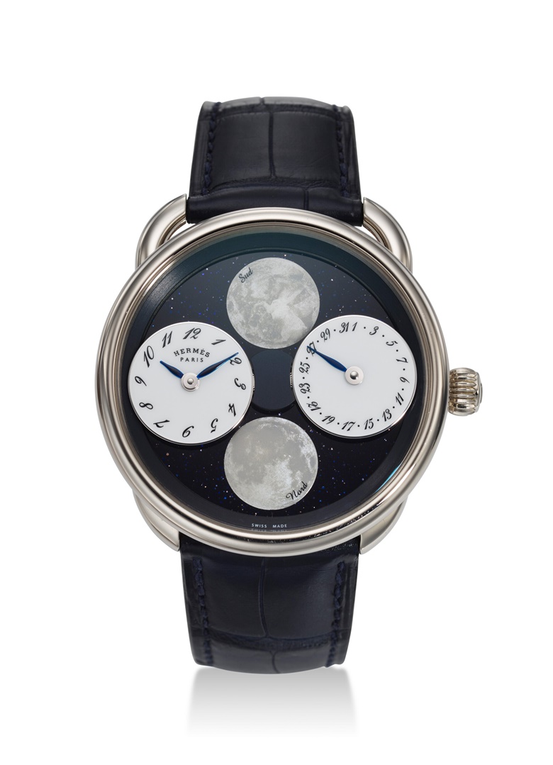 Hermès. Arceau lheure de la Lune, a fine limited edition 18K white gold wristwatch with mother-of-pearl moon phases, date, and blue aventurine dial. Case 43mm diameter. Sold for $22,680 in Watches Online The New York Edit on 13 December 2022 at Christies online