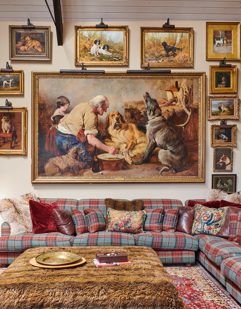 The ‘salon hang’ in the bar. Centre, Richard Ansdell, R.A. (1815-1885), The Wounded Hound, 1847. 58½ x 94 in (149.5 x 238.5 cm). Estimate £200,000-300,000. Offered in An Opulent Aesthetic An Important Private Collection from an English Country House on 9 February 2023 at Christie’s in London