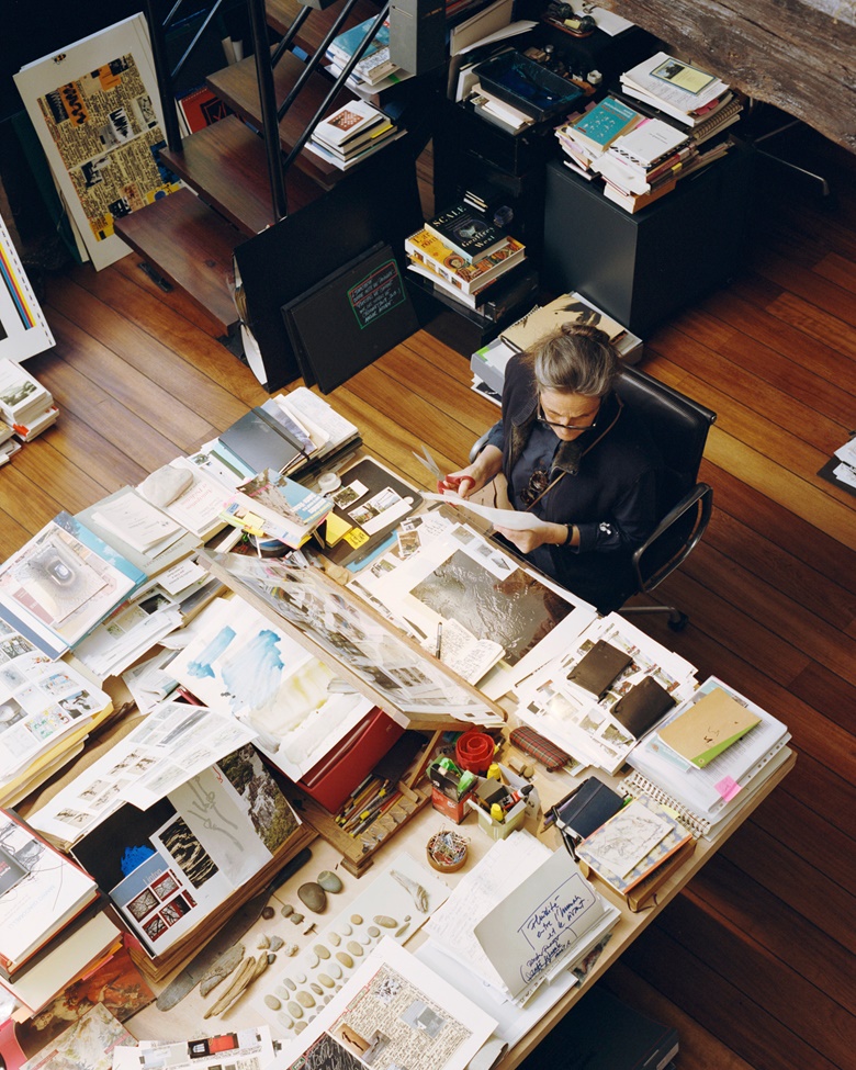 The artist working on her notebooks of cuttings, 2019. Photo Allyssa Heuze