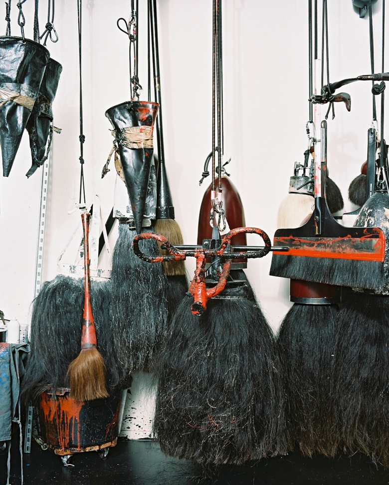 The artist’s tools brushes and funnels hang in the studio, 2019. Photo Allyssa Heuze