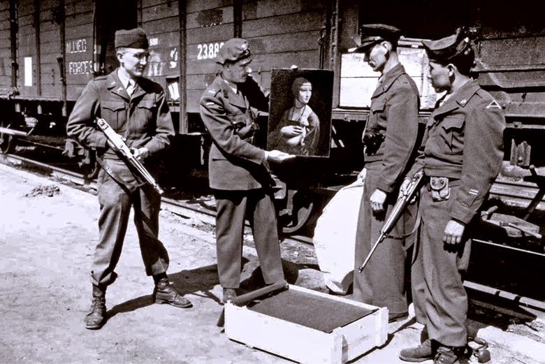 Art historian Karol Estreicher, American MFAA officer Lt. Frank P. Albright, and two other GIs look at Leonardo da Vinci’s Lady with an Ermine before its return to a museum in Kraków after being stolen by Nazi Germany in World War 2, 1945. Photo by Shawshots  Alamy Stock Photo