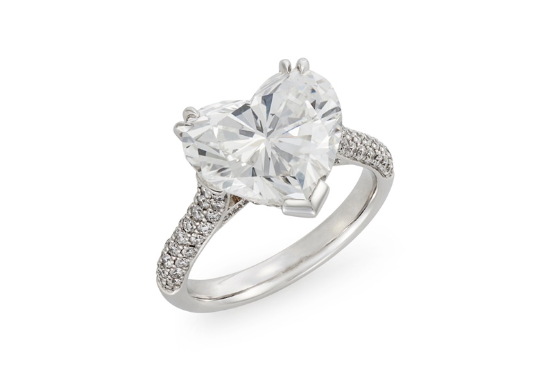 A heart-shaped diamond ring. Heart-shaped diamond of 5.06 carats, circular-cut diamonds, platinum and gold, US ring size 6. Available for immediate purchase. Price on request