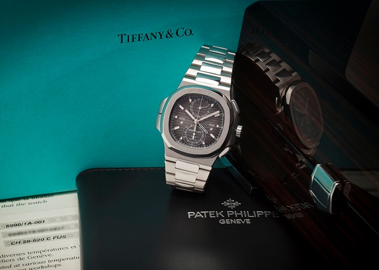 A Patek Philippe Nautilus ref. 59901A ‘Tiffany’, circa 2015. A steel dual-time chronograph with Tiffany retail signature on dial. Available to purchase immediately. Price on request