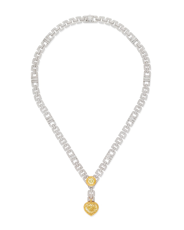 A yellow diamond and diamond necklace. Heart-shaped Fancy Vivid Yellow VS1 diamond of 10.03 carats, round brilliant-cut Fancy Intense Yellow IF diamond of 1.52 carats, 48.5 cm; pendant length 4.5 cm. Available to purchase immediately. Price on request