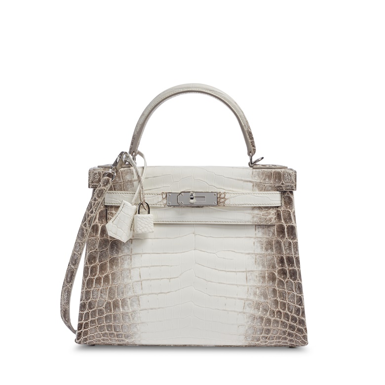 A matte white Himalaya Niloticus Crocodile Retourné Kelly 28 with palladium hardware, Hermès, 2022. Available to purchase immediately. Price on request