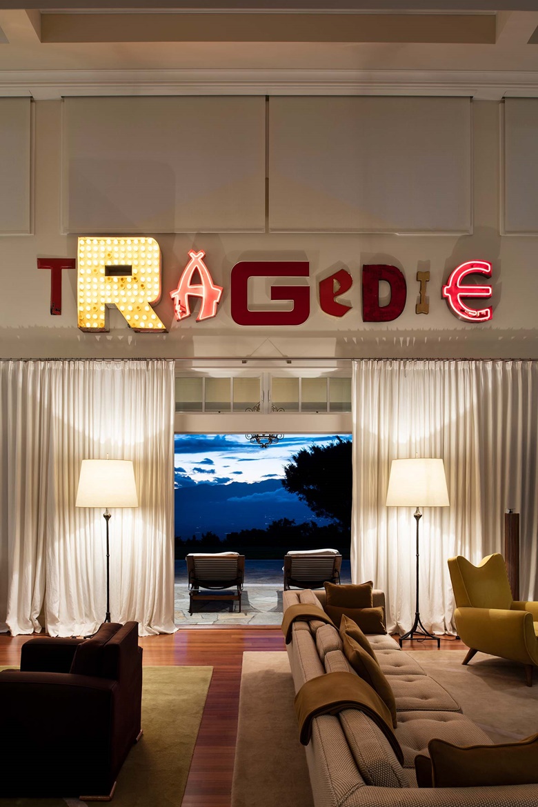 Jack Pierson’s Tragedie hangs about Alberto Giacometti’s ‘Osselet’ floor lamps in the living room