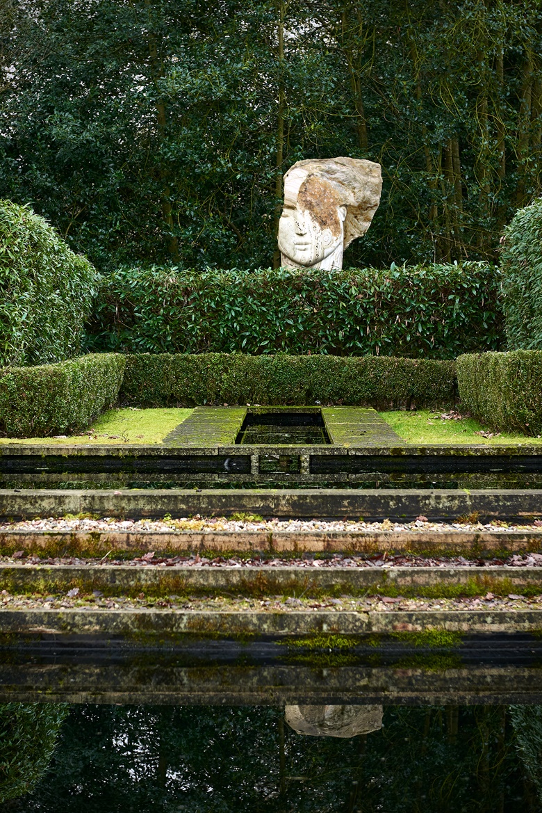 Emily Young (b. 1951), Time Boy, 2011, shown in situ at at Copse Farm in Hampshire. 66⅞ in (170 cm) high. Estimate £200,000-300,000. Offered in The Robin and Rupert Hambro Collection on 8 June 2023 at Christie’s in London