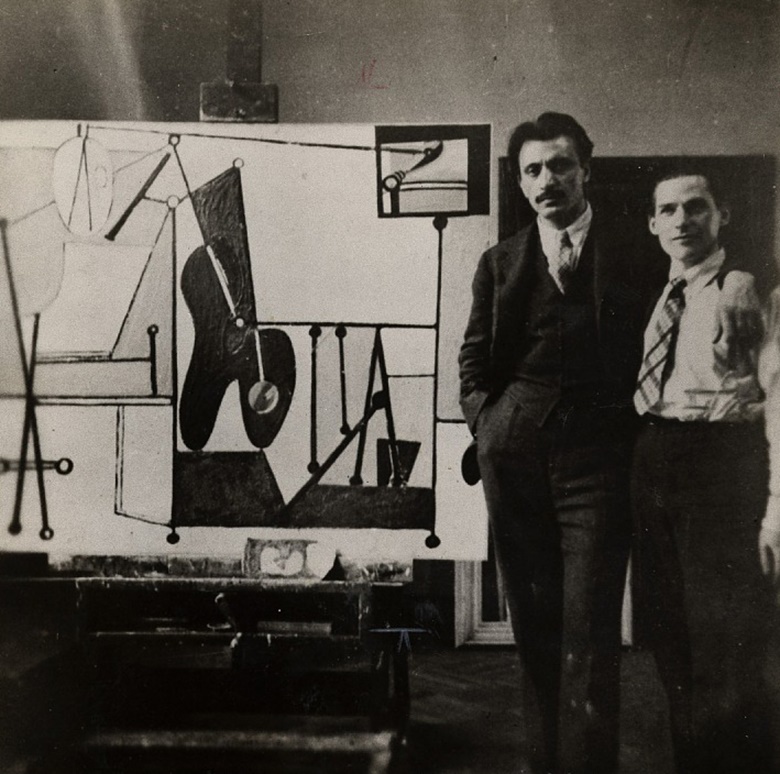 Arshile Gorky and Willem de Kooning in Gorkys studio, c. 1937. Photo Oliver Baker  Rudi Blesh papers, Archives of American Art, Smithsonian Institution. Artwork © 2023 The Arshile Gorky Foundation  Artists Rights Society (ARS), New York