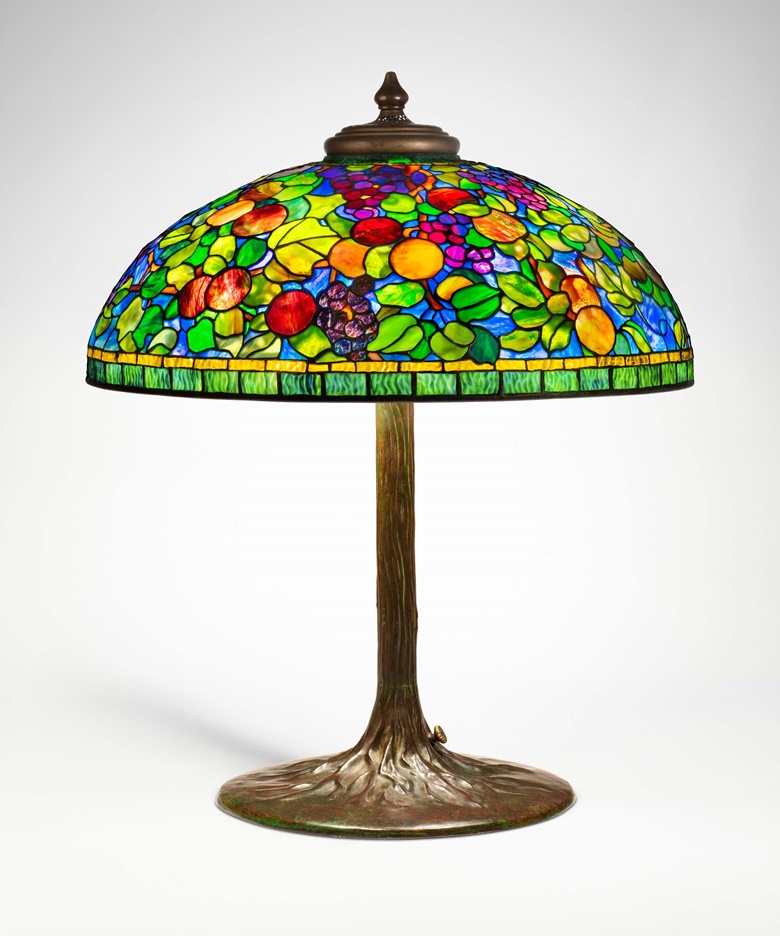 Tiffany Studios, Rare ‘Fruit’ table lamp, c. 1910. Leaded glass, patinated bronze. 29½ in (75 cm) high, 24⅜ in (61.1 cm) diameter. Estimate $250,000-350,000. Offered in Design on 8 June 2023 at Christie’s in New York