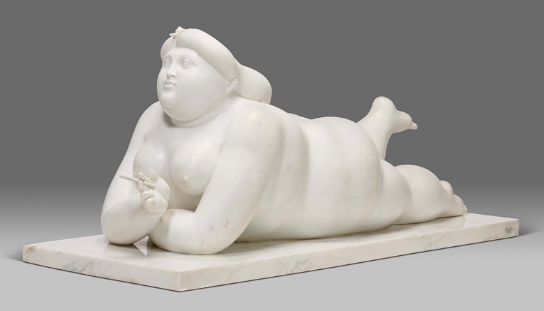 Fernando Botero (b. 1932), Mujer fumando, 1986. White Carrara marble. Height 23 in (58.4 cm); width 55½ in (141 cm); depth 22 in (56 cm). Estimate $1,000,000-1,500,000. Offered in Latin American Art on 9 March 2023 at Christie’s New York