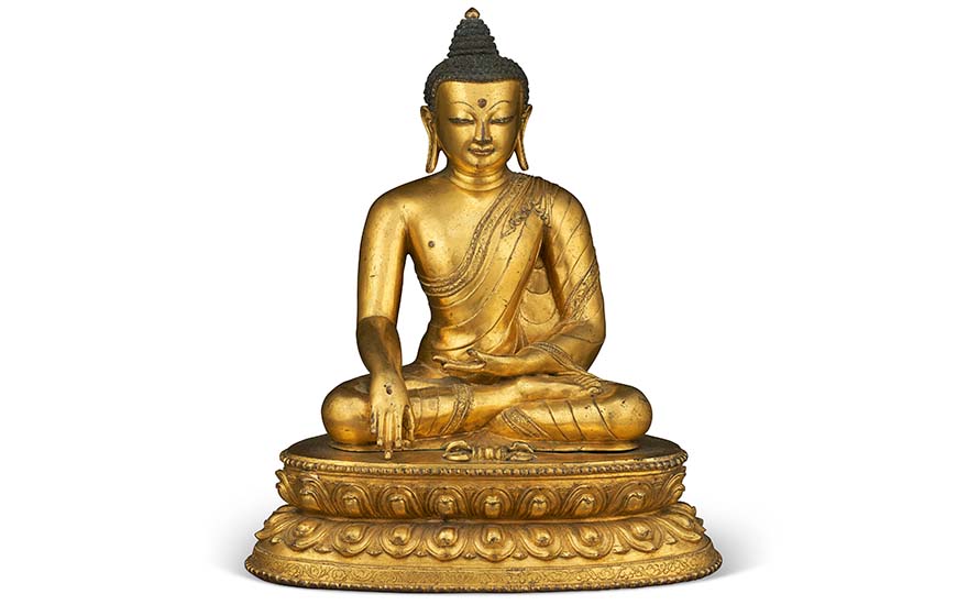 A large gilt-bronze figure of Akshobhya, Tibet, 15th century. 13⅞ in (35.2 cm) high. Estimate $120,000-180,000. Offered in Indian, Himalayan and Southeast Asian Art on 22 March 2023 at