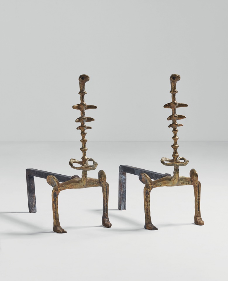 Diego Giacometti (1902-1985), Pair of Carcasse’ Andirons, 1975. Gilt bronze, patinated iron. 18⅜ x 7⅛ x 15 in (46.7 x 18.1 x 38 cm). Estimate $250,000-$350,000. Offered in Designs By Alberto and Diego Giacometti on 9 December 2022 at Christie’s New York