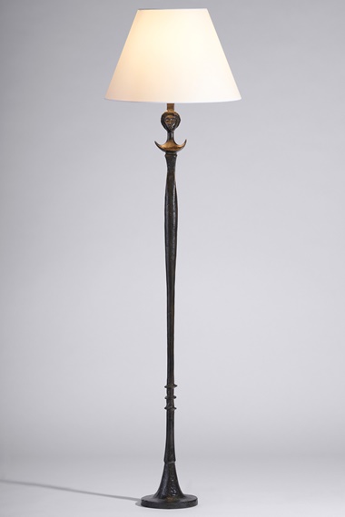 Alberto Giacometti (1901-1966), ‘Figure’ floor lamp (Téte de Femme), 1933-34. Patinated bronze, paper shade. 71 in (180.3 cm) high, 20 in (50.8 cm) diameter of shade. Sold for $378,000 in Designs By Alberto and Diego Giacometti on 9 December 2022 at Christie’s New York
