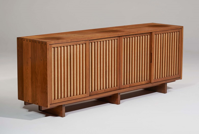 George Nakashima (1905-1990), Custom Four-door cabinet, 1959. American black walnut, pandanus cloth. 32 x 84 x 20 in (81.3 x 213.4 x 50.8 cm). Estimate $30,000-50,000. Offered in Art of Collecting A Pacific Island Connoisseur of Art and Design on 7 March 2023 at Christie’s New York