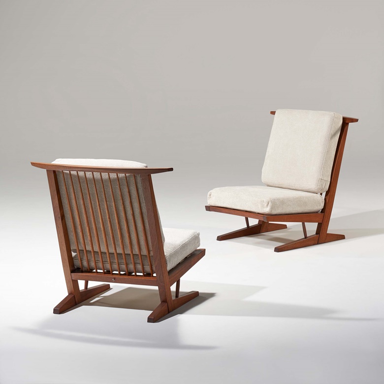 George Nakashima (1905-1990), Pair of Conoid lounge chairs. American black walnut, hickory, rubber, fabric upholstery. 33⅜ x 34 x 34 in (84.8 x 86.4 x 86.4 cm). Estimate $20,000-30,000. Offered in Art of Collecting A Pacific Island Connoisseur of Art and Design on 7 March 2023 at Christie’s New York